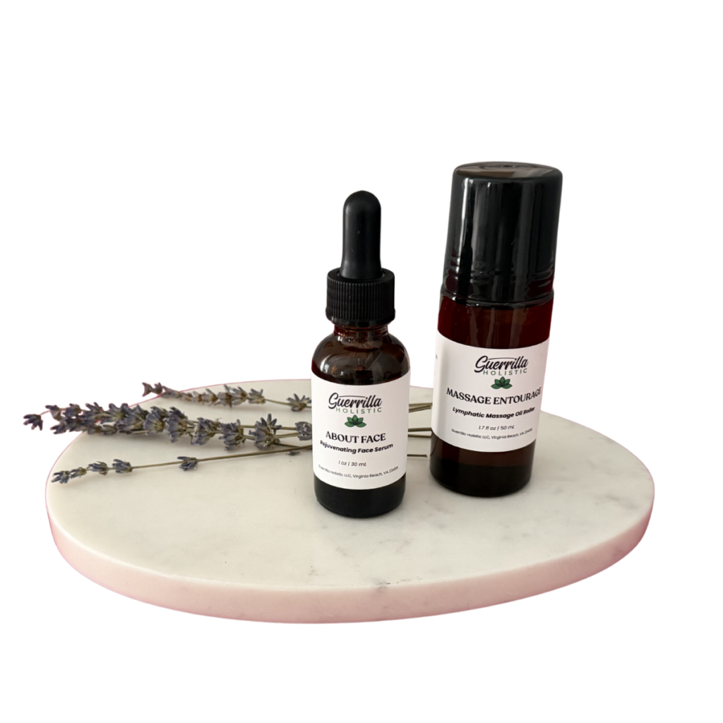 About Face serum and Massage Entourage oil on marble tray with lavender